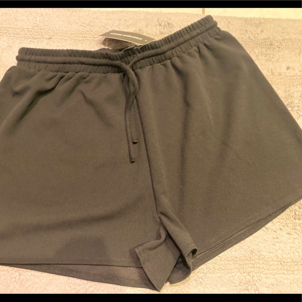 Large black vacation/ summer or everyday wear cool confident very stretchy fit